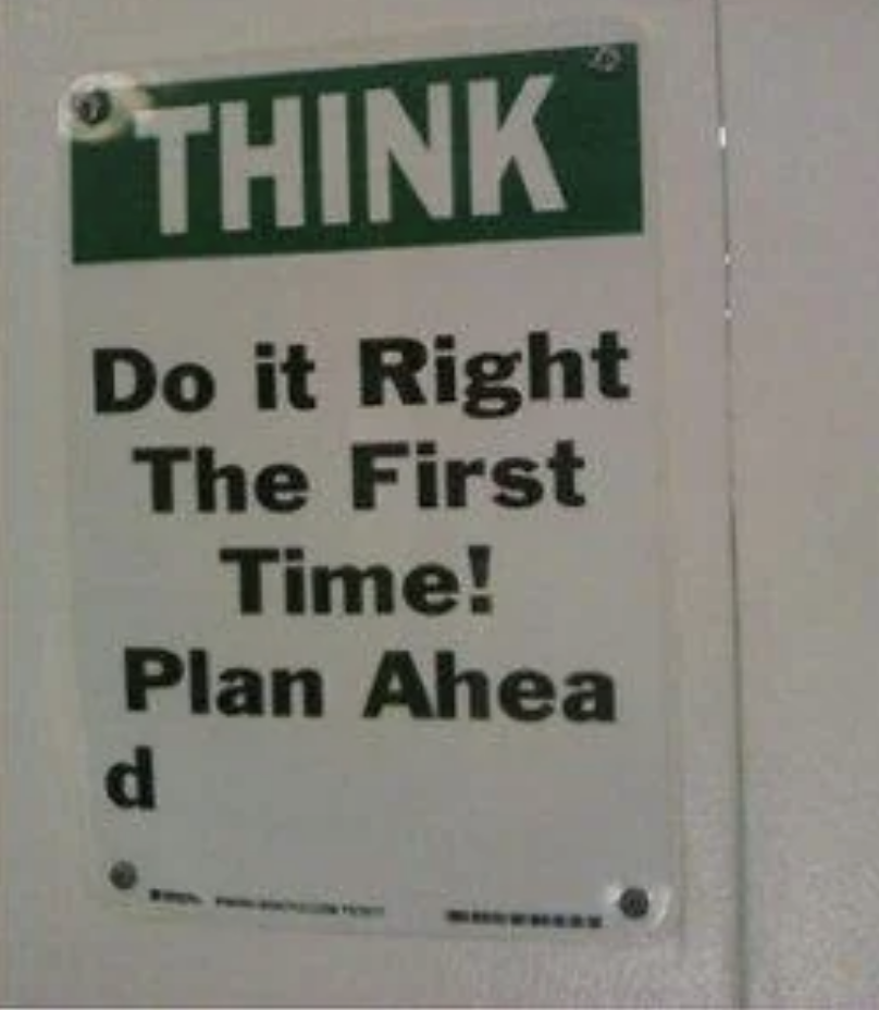 A sign reads: &quot;THINK. Do it Right The First Time! Plan Ahead.&quot; The word &quot;Ahead&quot; is split with &quot;Ahea&quot; on one line and &quot;d&quot; on the next line