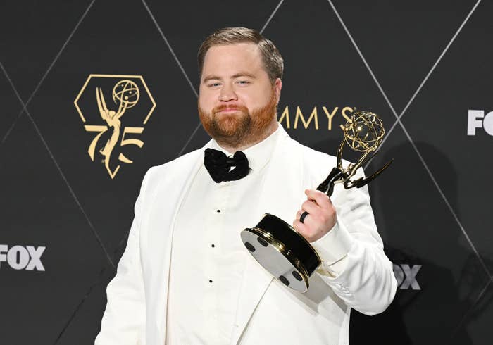 Closeup of Paul Walter Hauser holding an Emmy