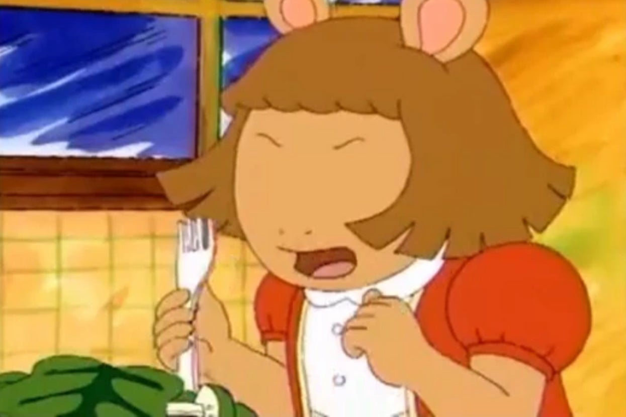 DW from the animated series "Arthur" is holding a fork and yelling at the dinner table