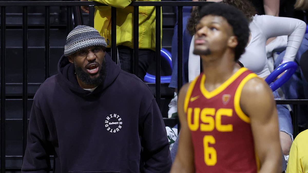 The 19-year-old former USC guard and 39-year-old NBA veteran become the first father-son duo to play together in the league.