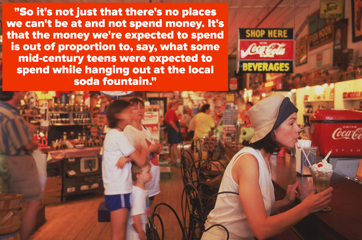 A busy diner with people enjoying their drinks and food. A woman in the foreground sips from a drink. Various vintage signs are visible