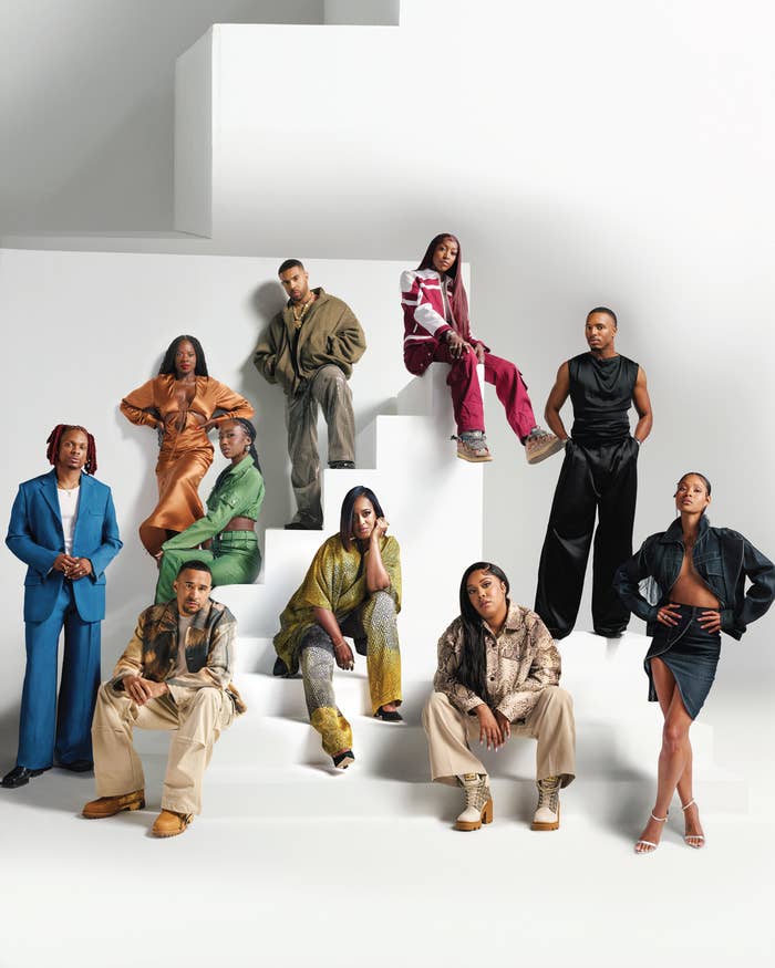 Posed group photo featuring various people in stylish, modern outfits