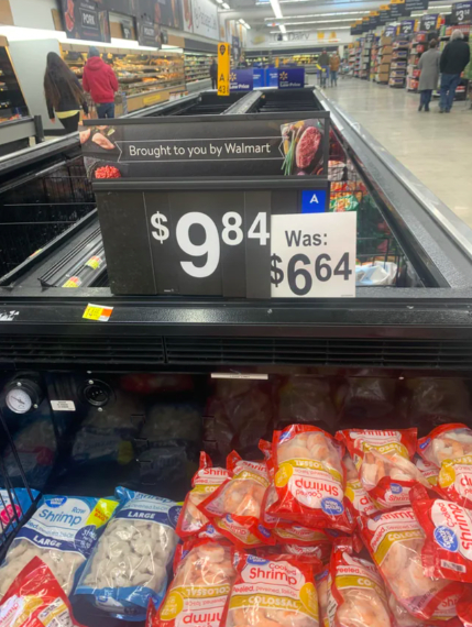 Frozen shrimp in a Walmart store with a price of $9.84, increased from $6.64