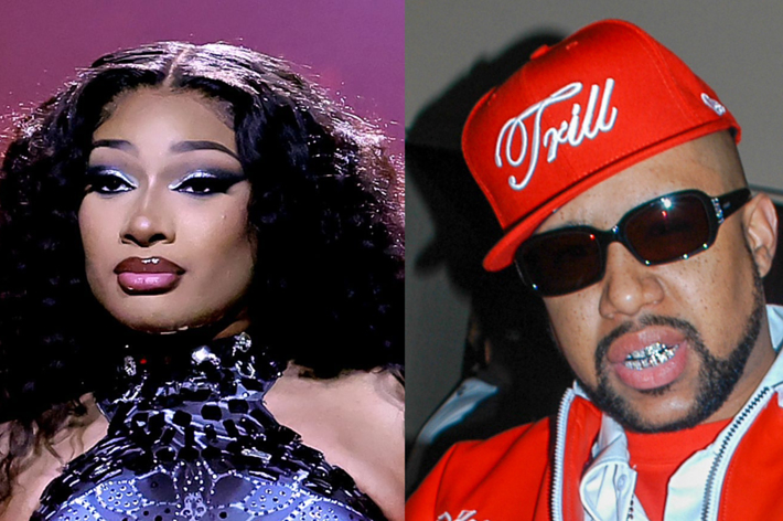 Megan Thee Stallion in a black, embellished top alongside a man in a red hat and sunglasses with a "Trill" logo, wearing a red and white jacket