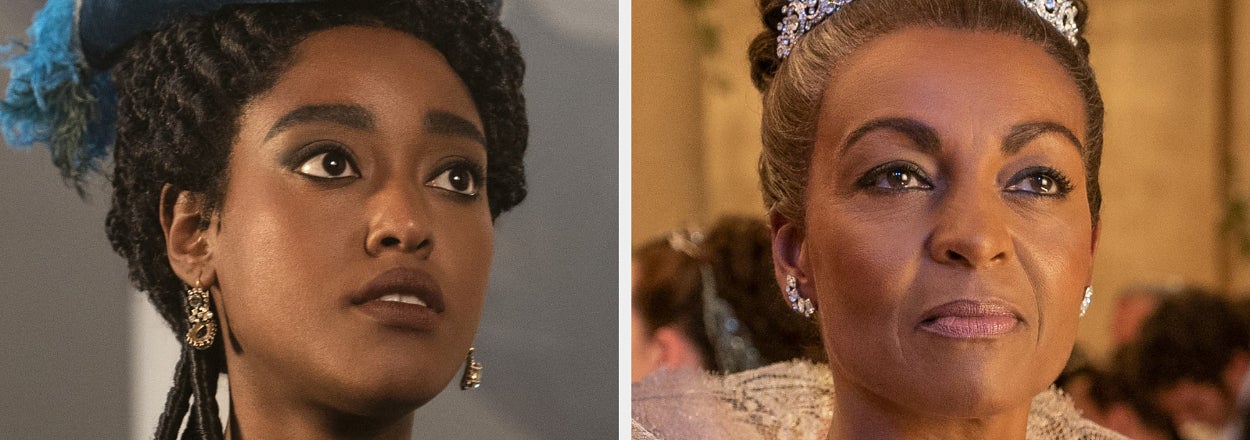Arsema Thomas in historical attire with a feathered hat, and Adjoa Andoh in a regal gown and jeweled tiara, from a scene in "Queen Charlotte: A Bridgerton Story."
