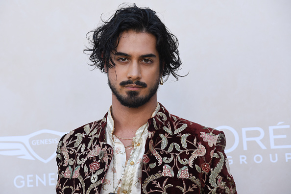 Avan Jogia in an ornate, embroidered outfit at an event