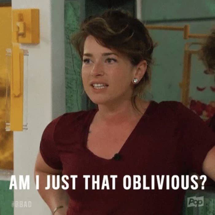The image shows a woman in a relaxed at-home setting with text overlayed that reads, &quot;Am I just that oblivious?&quot; #BBAD
