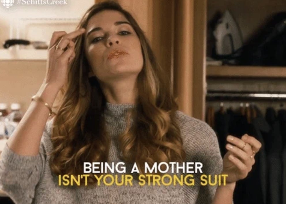 Annie Murphy as Alexis Rose from Schitt&#x27;s Creek raising a hand to her face. Caption reads: Being a mother isn&#x27;t your strong suit
