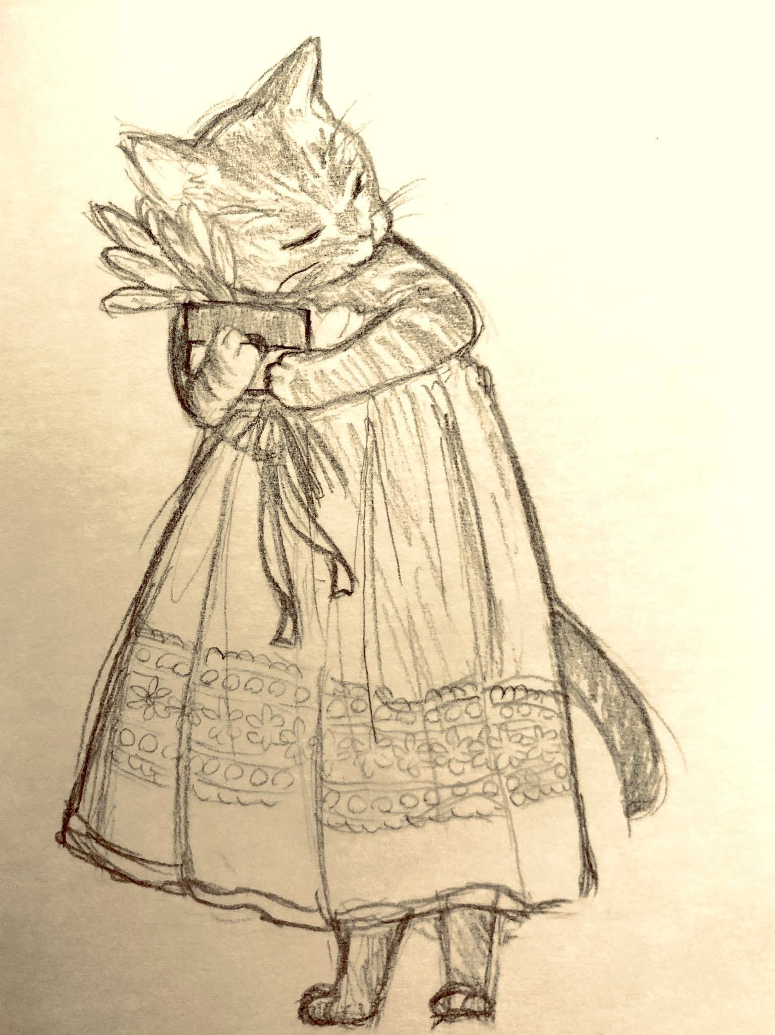 猫が本を抱えてドレスを着ているスケッチ。