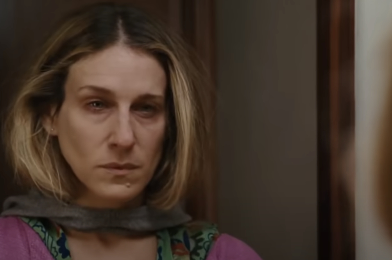 Carrie Bradshaw stares in the mirror looking like she just cried