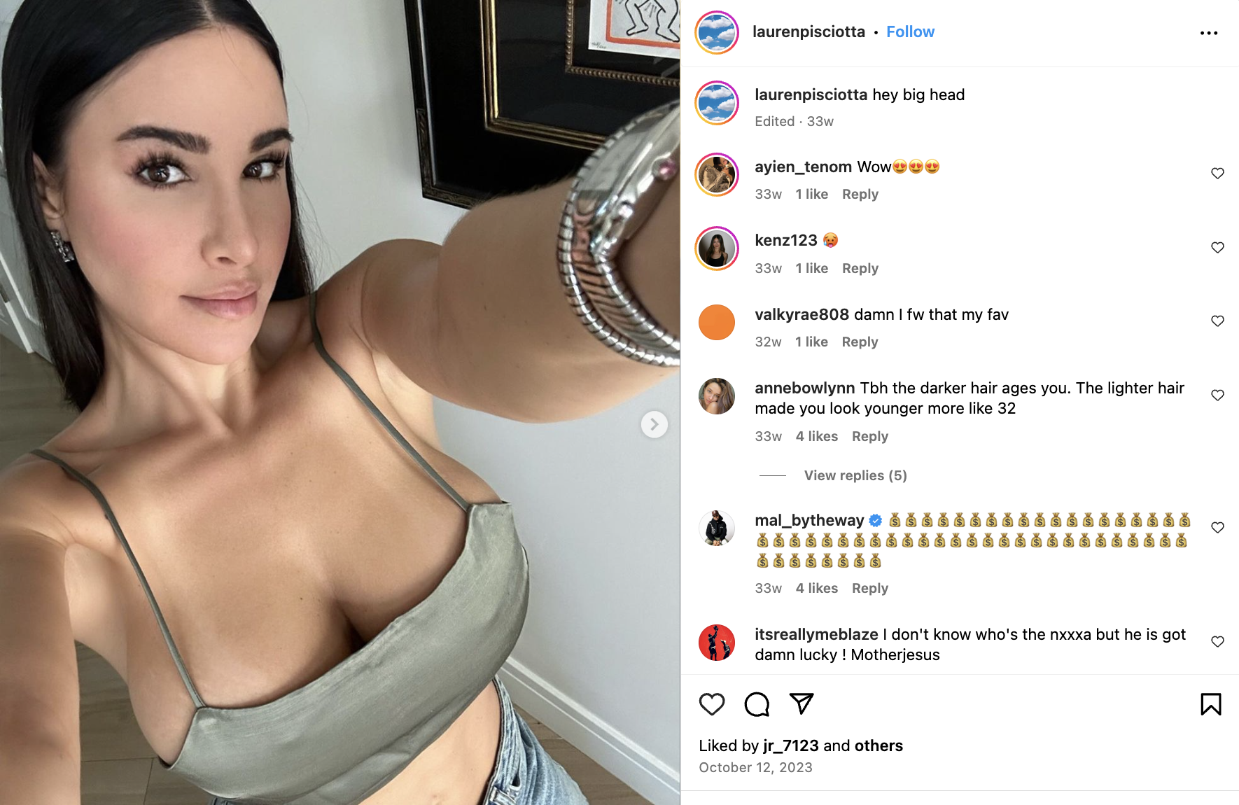Lauren Pisciotta taking a selfie in a crop top. Comments from followers are visible, praising her appearance