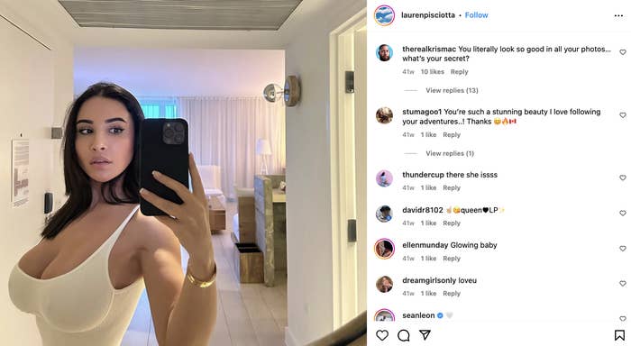 Lauren Pisciotta takes a selfie in a white top in a bedroom. Various Instagram comments praise her appearance