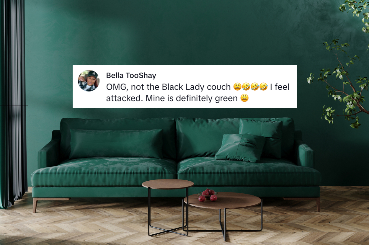 A green couch against a green wall with a plant in the corner. Text overlay reads: "Bella TooShay: OMG, not the Black Lady couch ??? I feel attacked. Mine is definitely green ?"