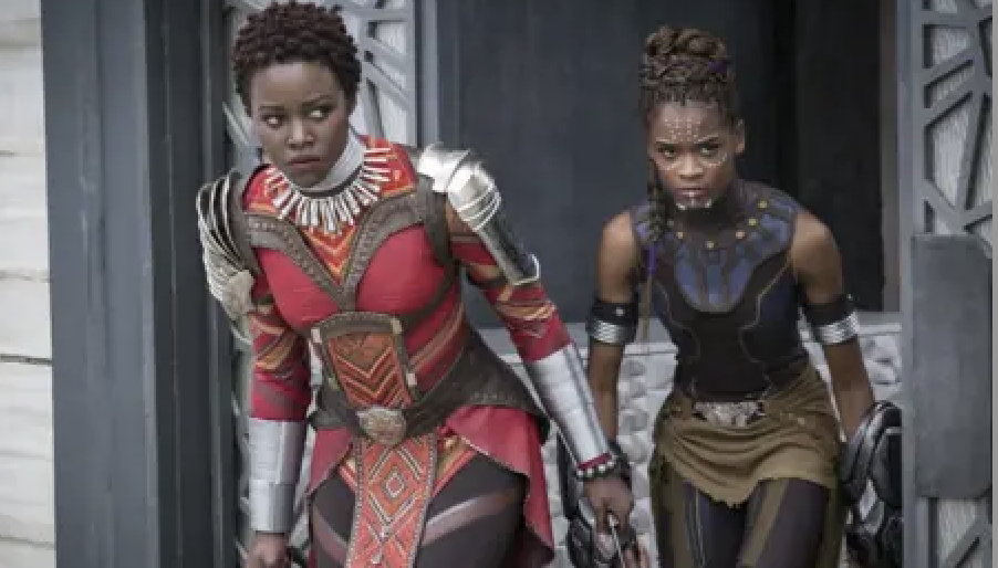 Lupita Nyong'o and Letitia Wright in Wakandan warrior costumes from a scene in the film "Black Panther."