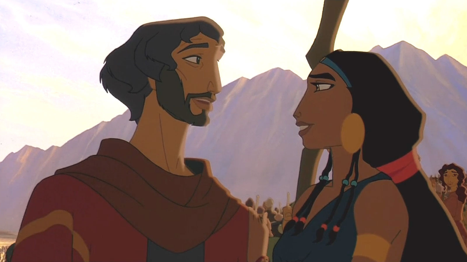 Moses and Tzipporah from "The Prince of Egypt" smile at each other with mountains in the background. Large group of people is seen at a distance