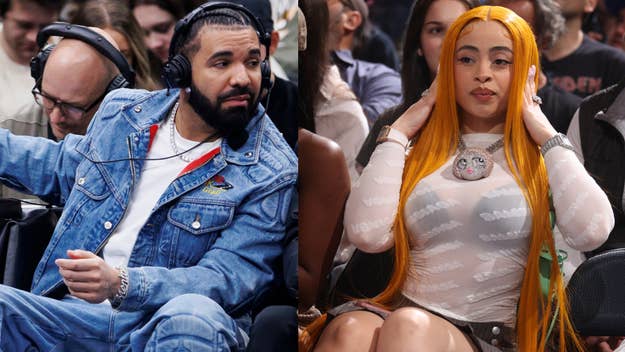 Drake in a denim jacket and white shirt sits courtside, and Ice Spice in a sheer white top with a pendant sits nearby at a basketball game