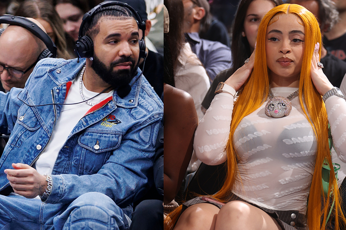 Drake in a denim jacket and white shirt sits courtside, and Ice Spice in a sheer white top with a pendant sits nearby at a basketball game