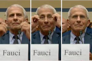 Dr. Anthony Fauci adjusts his glasses while speaking into a microphone during a hearing, seated behind a nameplate that reads "Fauci."