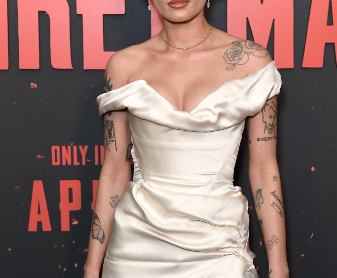 Halsey wearing an off-the-shoulder satin mini dress at a red carpet event