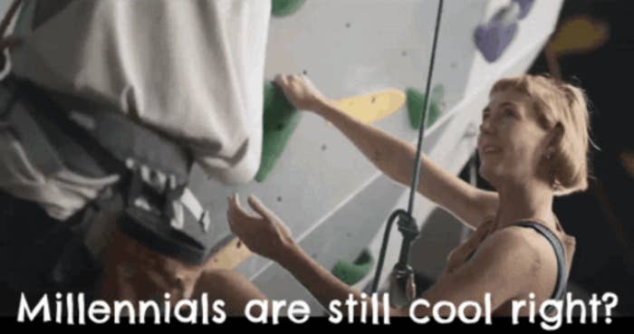 A person climbing a rock wall with another person assisting. Text reads, "Millennials are still cool, right?"