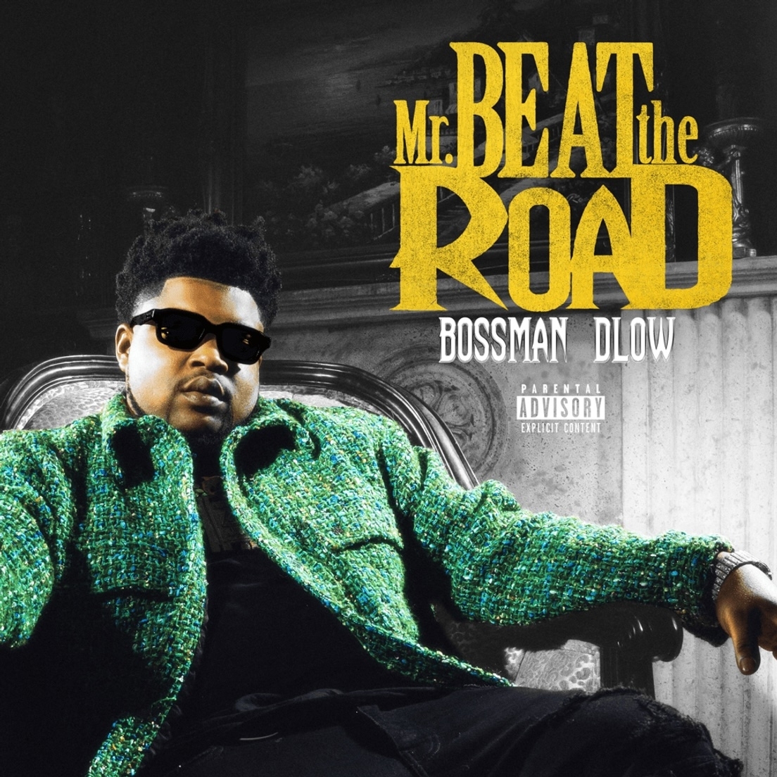 Bossman Dlow&#x27;s &quot;Mr. Beat the Road&quot; album cover features him seated in a chair wearing sunglasses and a textured jacket