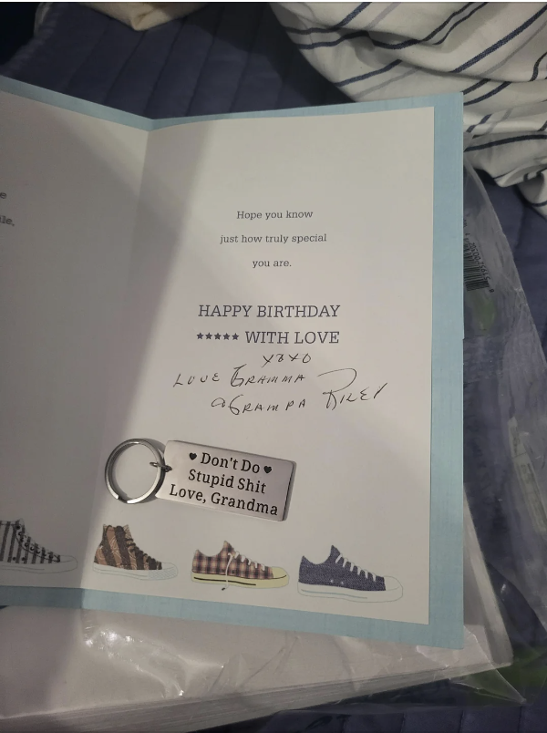 Birthday card reading "Happy Birthday with love. XOXO Love Grandma & Grandpa Duke" with a keychain that says, "Don't Do Stupid Shit. Love, Grandma."