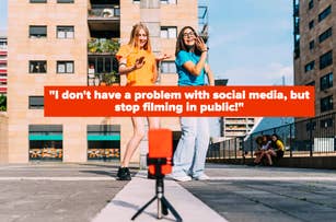 Two women are dancing happily outdoors, a camera is filming them, large text reads: "I don't have a problem with social media, but stop filming in public!"
