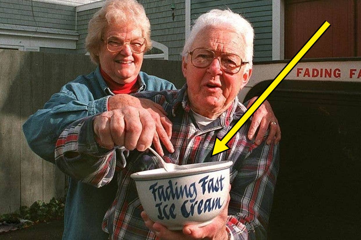 An elderly couple, both wearing plaid shirts, holds a bowl labeled "Fading Fast Ice Cream." The woman stands behind the man, smiling as he holds a scoop