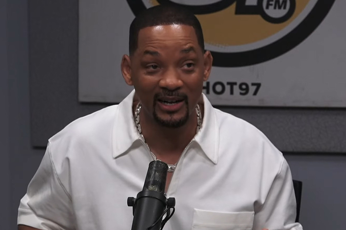 Will Smith speaking into a microphone during a radio interview at Hot 97 FM