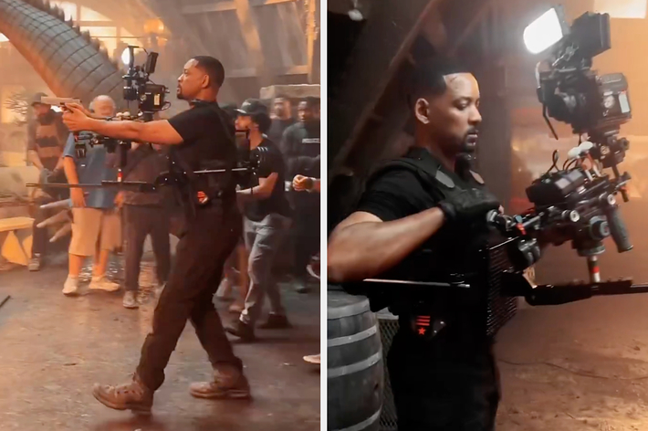 Will Smith operating a professional camera on a movie set, surrounded by crew members