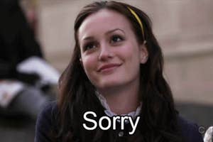 Leighton Meester smiling with the word "Sorry" overlayed on the image