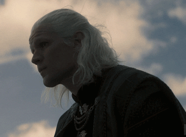 Matt Smith as Daemon Targaryen in &quot;House of the Dragon,&quot; looking pensive against a cloudy sky background