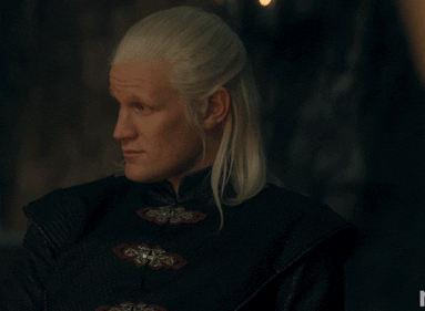 Matt Smith, as his character Prince Daemon Targaryen, in a medieval-inspired outfit with long silver hair, in a scene from the TV series &quot;House of the Dragon.&quot;