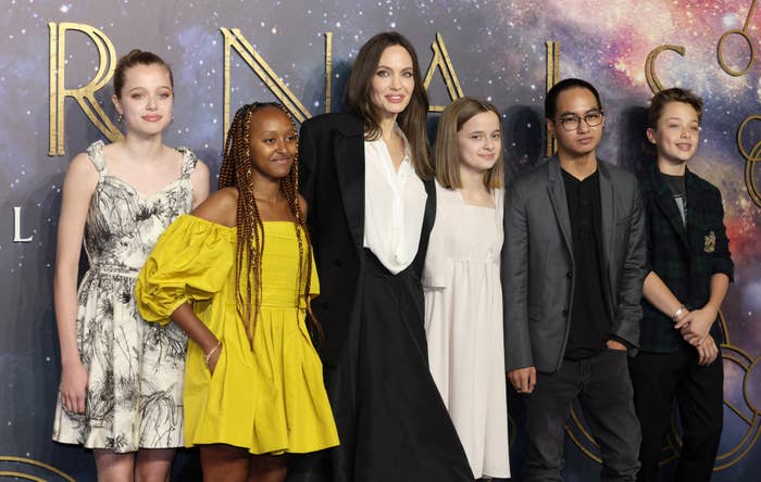 Angelina Jolie stands with Shiloh, Zahara, Vivienne, Pax, and Knox at a red carpet event