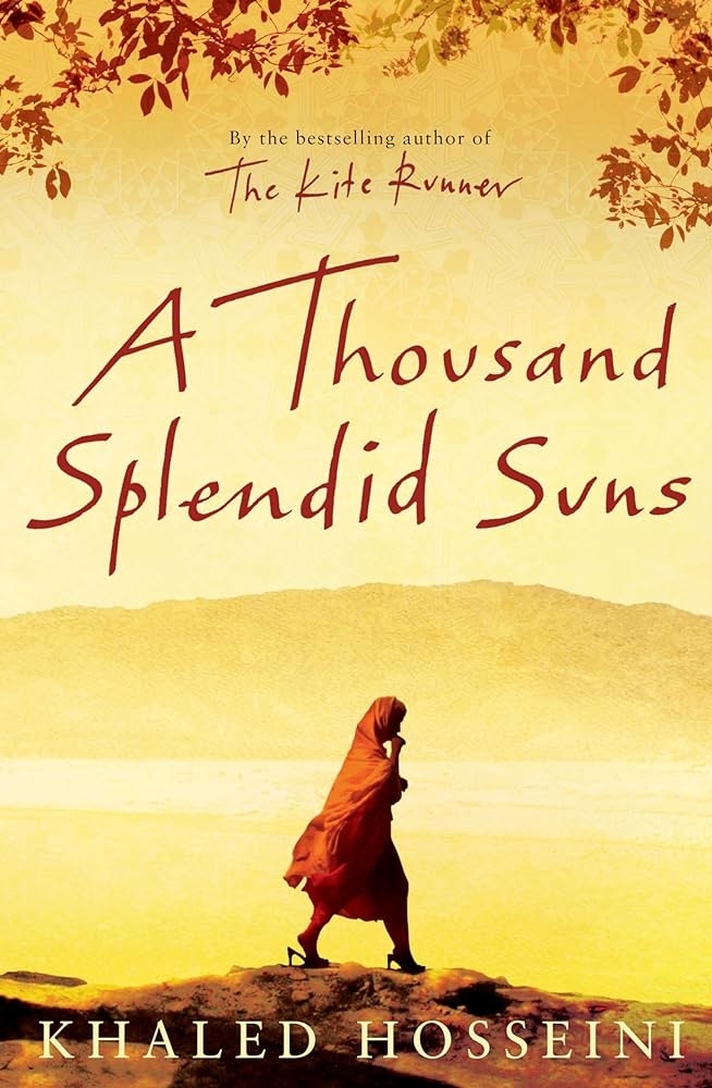 Book cover of &quot;A Thousand Splendid Suns&quot; by Khaled Hosseini with a lone figure in the foreground and mountains in the background. Text reads &quot;By the bestselling author of The Kite Runner.&quot;