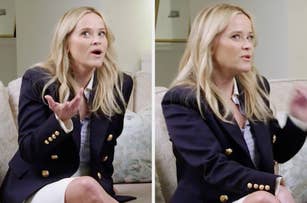 Reese Witherspoon is seated on a couch, wearing a blazer with gold buttons and a skirt. She appears expressive, gesturing with her hands while talking