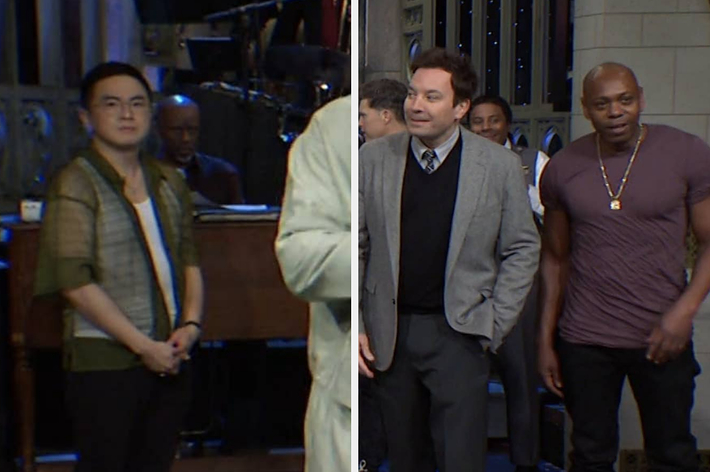 Bowen Yang in a green jacket, Jimmy Fallon in a gray blazer, and Dave Chappelle in a casual t-shirt standing on stage