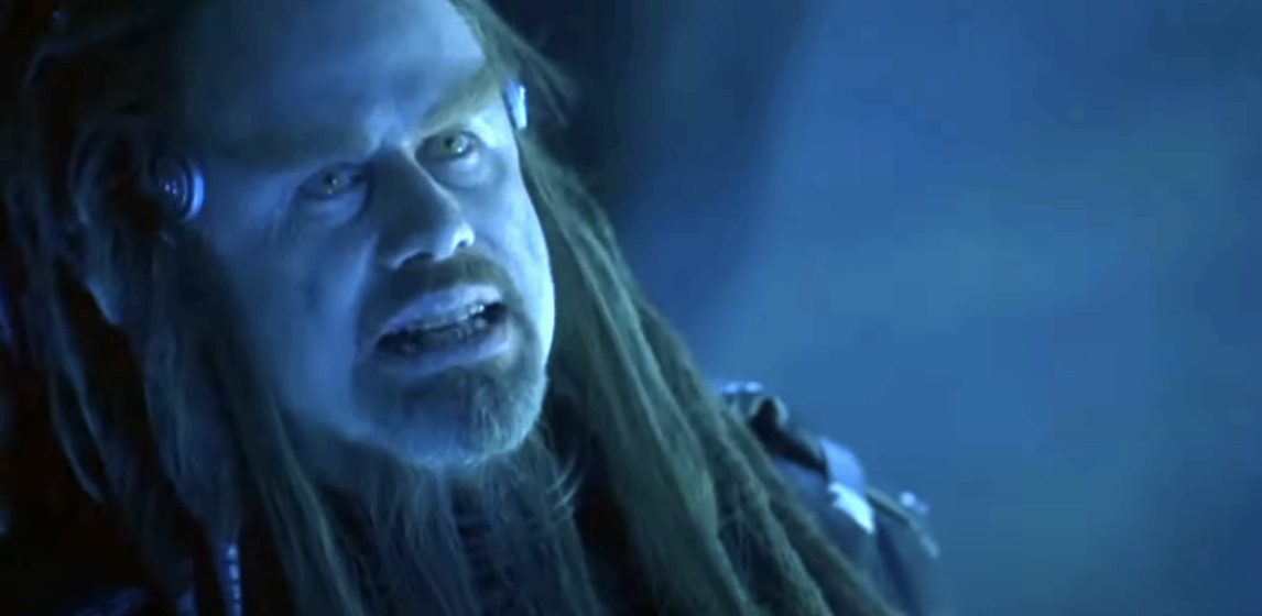 John Travolta in character with long dreadlocks and stern expression from the movie &quot;Battlefield Earth&quot;