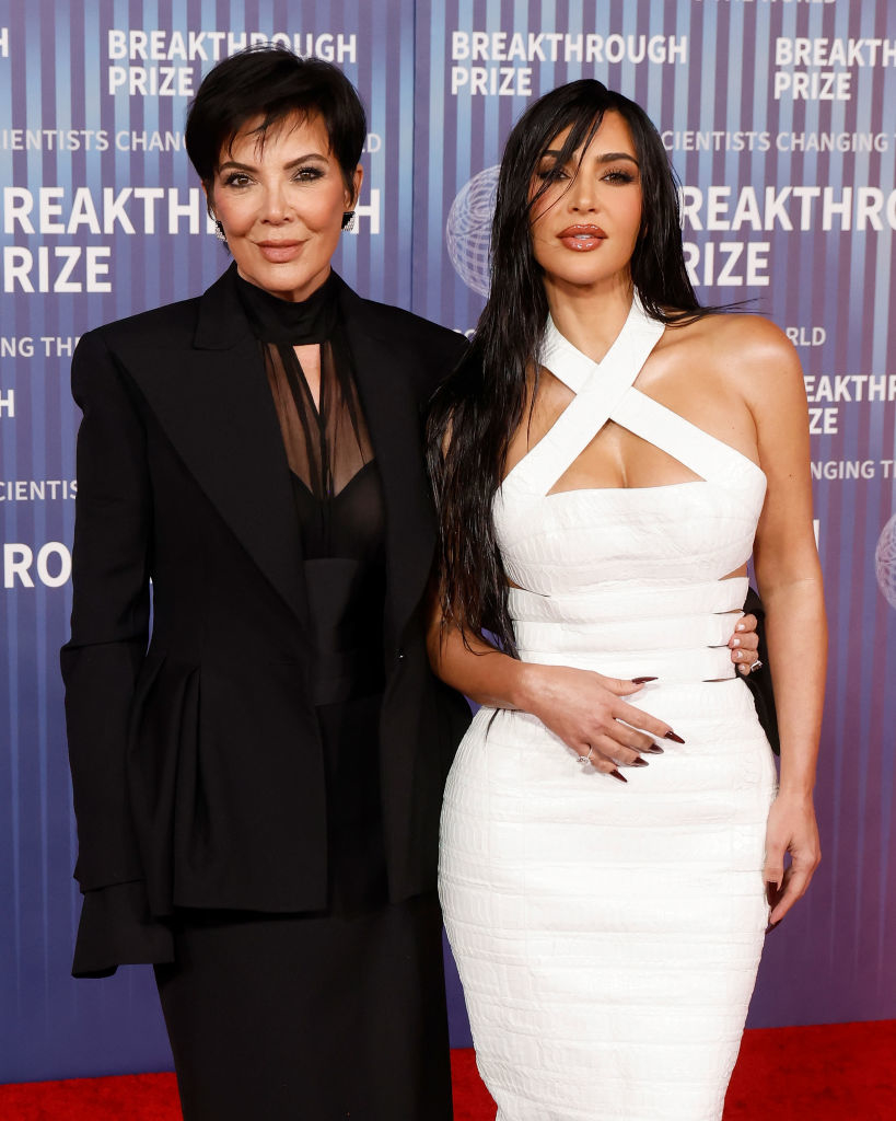 Kris Jenner in a pantsuit and Kim Kardashian in a halter dress on the red carpet at the Breakthrough Prize event