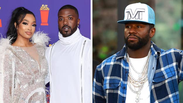 Princess Love in a glittery dress with feather details stands with Ray J in a white outfit at an event. Floyd Mayweather Jr. wears a blue plaid shirt and cap