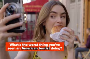 Lily Collins takes a selfie while eating a pastry. Text on the image reads: "What's the worst thing you've seen an American tourist doing?"