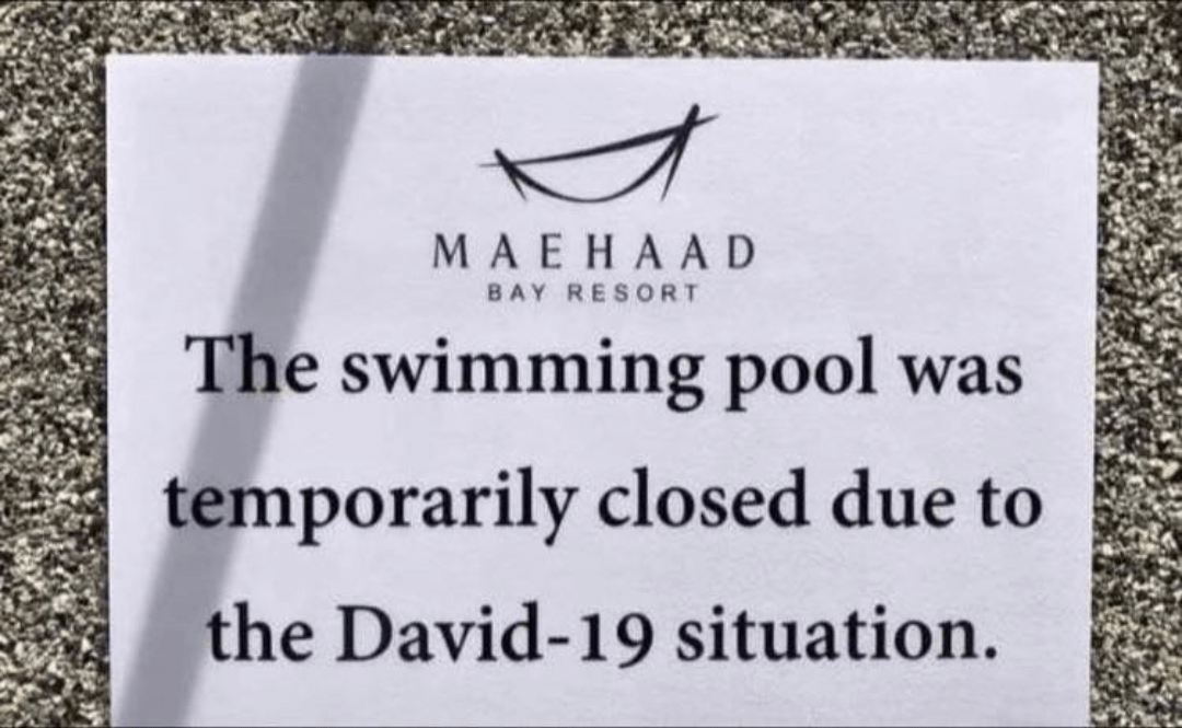 Sign at Maehad Bay Resort reads: "The swimming pool was temporarily closed due to the David-19 situation," with a typographical error