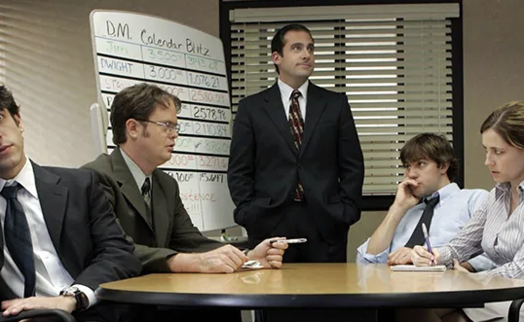 Scene from &quot;The Office&quot; with Rainn Wilson, Steve Carell, John Krasinski, Jenna Fischer, and B.J. Novak around a table in a business setting