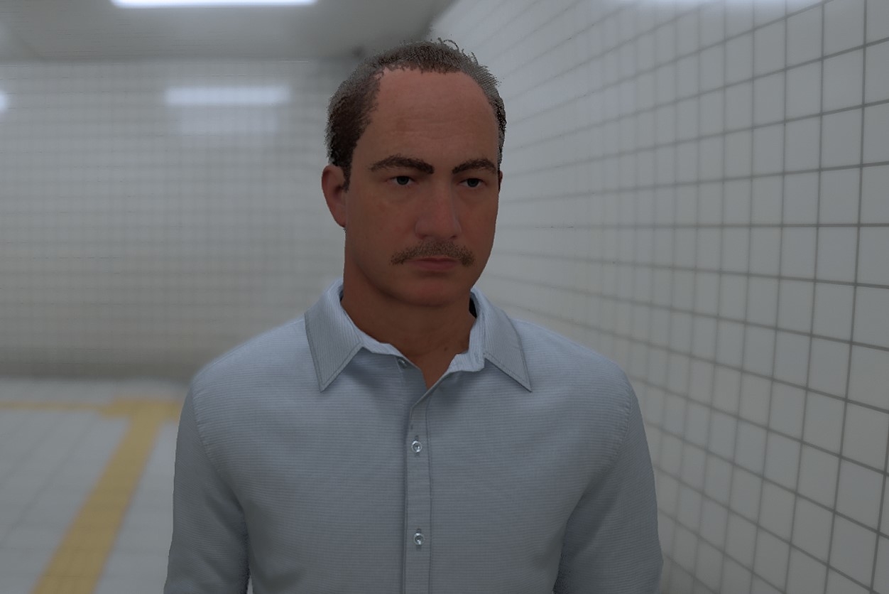 男性が地下鉄のタイル張りの廊下に立っている。