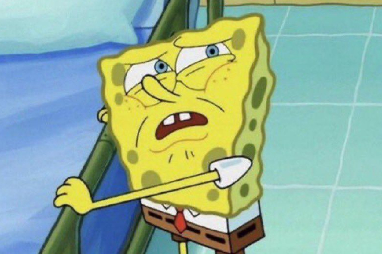 SpongeBob SquarePants looks stressed and fatigued while holding onto a bed railing