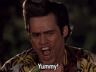 Jim Carrey as Ace Ventura making an exaggerated expression and saying, "Yummy"