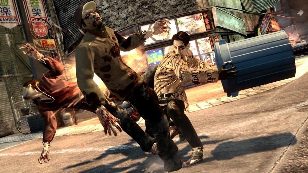 ゲームのシーン。プレイヤーキャラクターが路上でゾンビを攻撃している。背景は都市の風景。