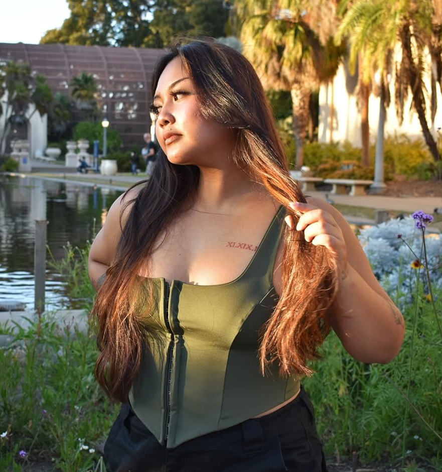 Reviewer wearing the olive top