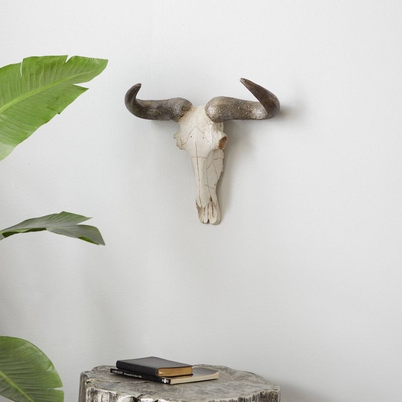 The cow skull hanging on a wall