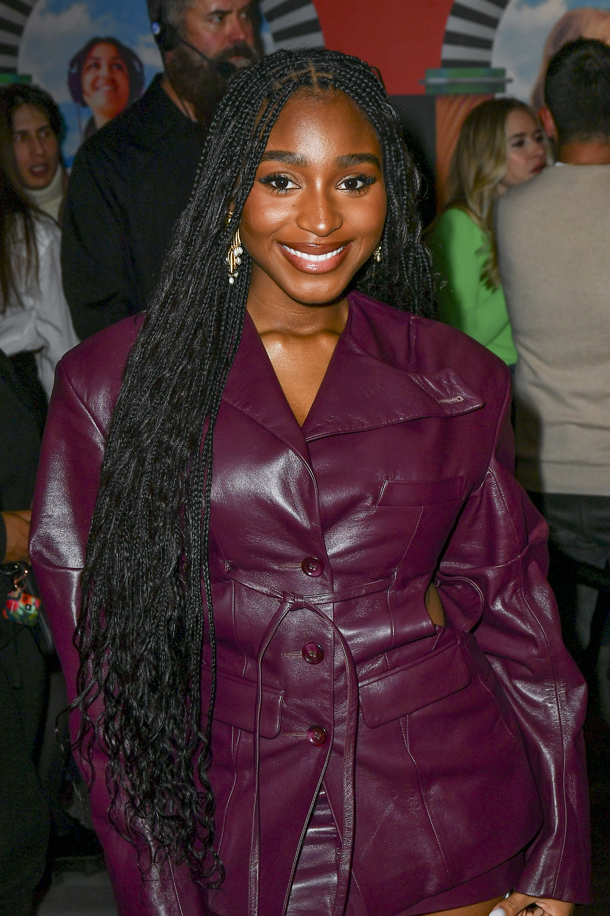 Normani rocks braids and wears a stylish fitted leather jacket